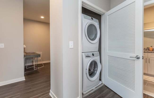 A white washer and dryer in a laundry room.