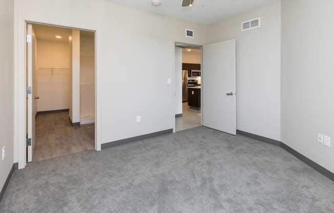 Spacious living room with neutral walls and ample natural light.