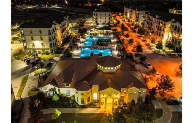 night-time aerial view of Park at Bayside apartments