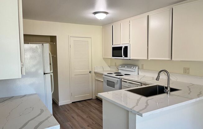Large two-story townhouse with 3 bedrooms and 2 full baths and a private patio