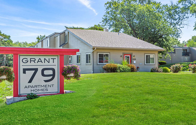 a yard sale sign in front of a house