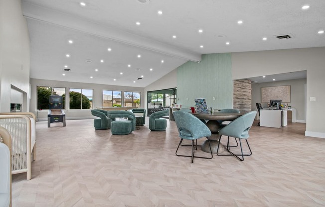 a large living room with a table and chairs at Edge At Farmington Hills - Farmington Hills, MI, Farmington Hills, Michigan