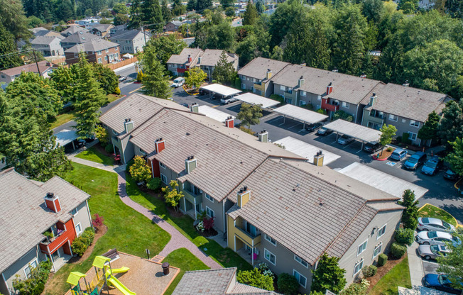 an aerial view of a neighborhood of houses with roofs at Quartz Creek, Washington