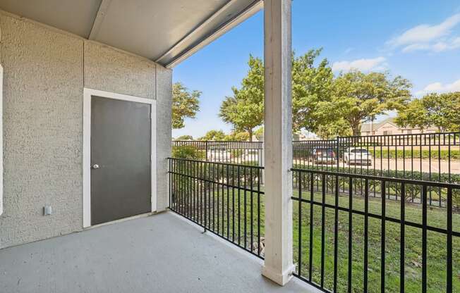 balcony outlook with metal fence and grass