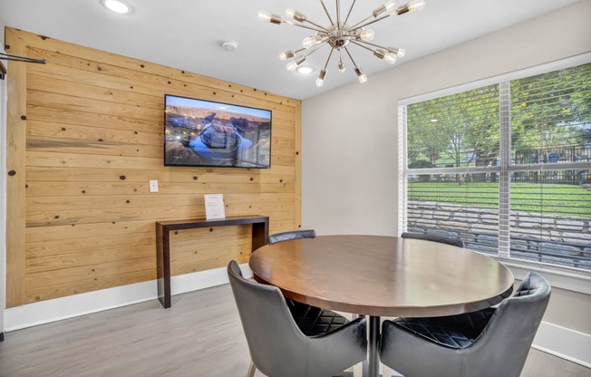 a dining room with a table and chairs and a large window at Sunset Ridge, San Antonio, TX, 78209