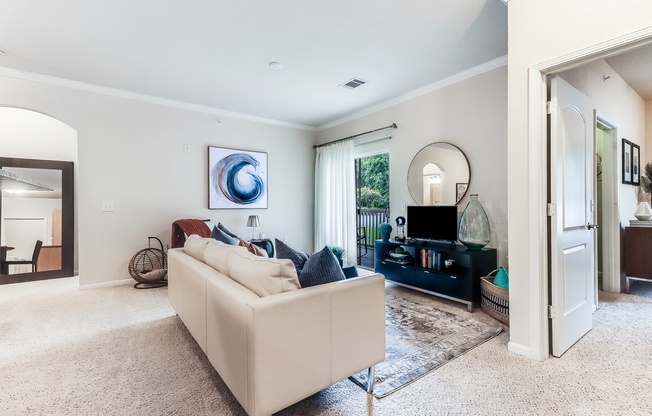 A living room with a white couch and a painting on the wall, Plantation Crossing, Lafayette, LA, 70508