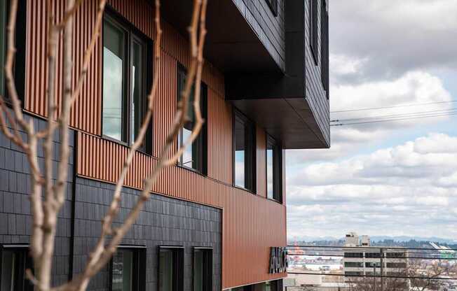 a view of the corner of a building with a city in the background at Analog Tacoma, Tacoma, WA, 98402