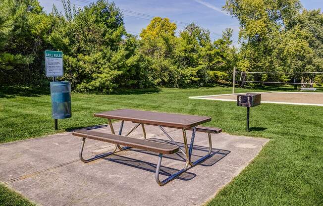 Charcoal grill with picnic table at Ashton Brook Apartments