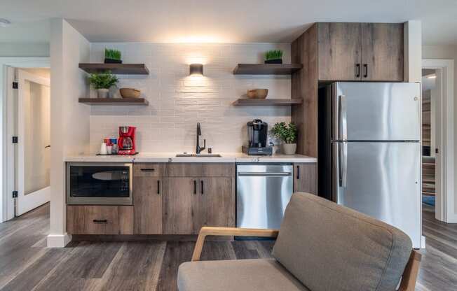 a kitchen with stainless steel appliances and a stainless steel refrigerator