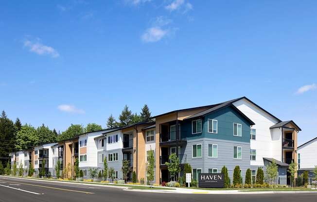an image of a apartment building with a blue sky in the background