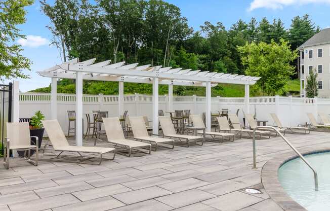 take a dip in the pool under the shade of the pergola