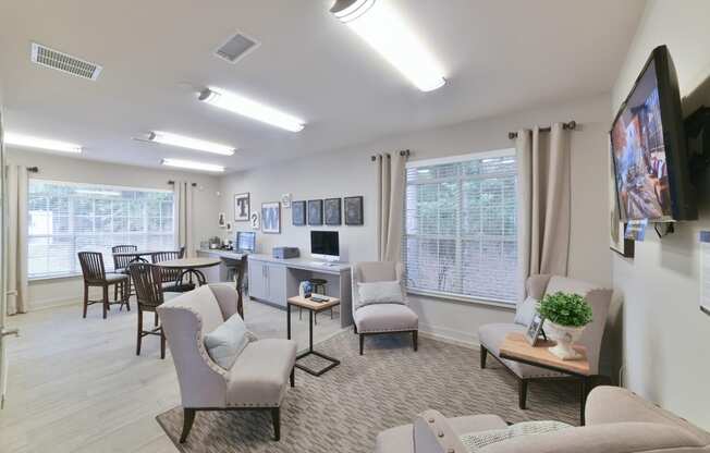 a living room with couches and chairs and a dining room with a table at Twenty35 at Timothy Woods, Athens