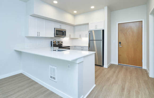 Kitchen with Stainless Steel Appliances and Breakfast Bar