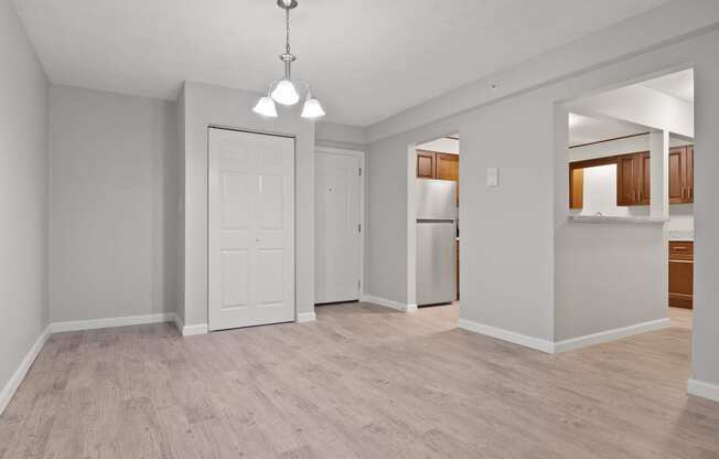 Dining area with closet and entrance to kitchen  at the River, Manchester, 03102