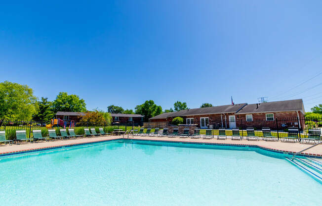 Outdoor pool with ample seating at Ashton Brook Apartments