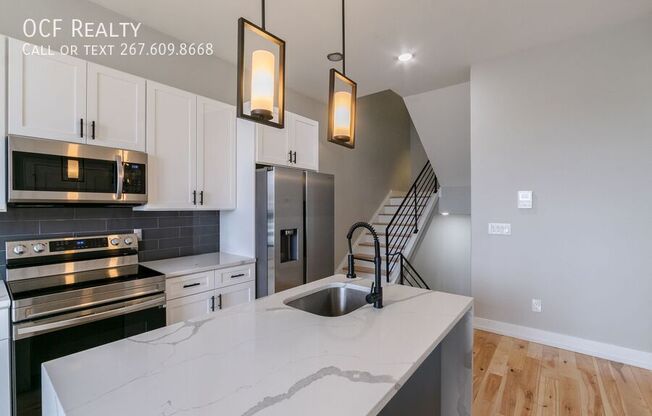 411 W HEWSON ST