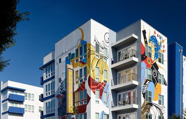 a building with graffiti on it on a city street