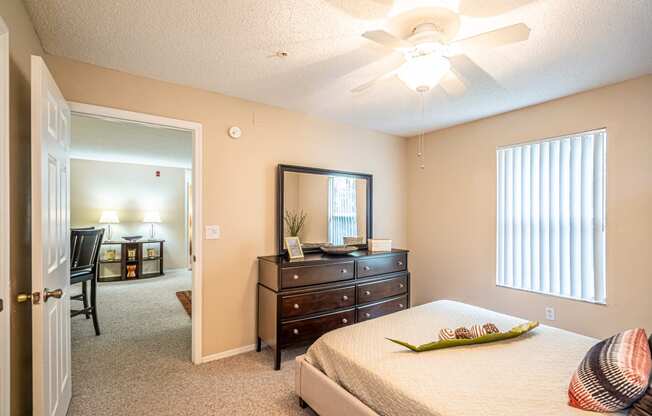 Model apartment home bedroom with a dresser