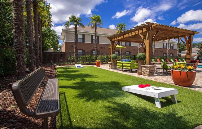 a yard with a picnic table and a swing