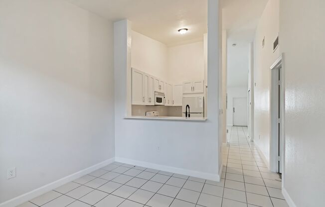 2-bath condo on the 2nd floor with a newly renovated kitchen featuring modern cabinets and granite countertops.