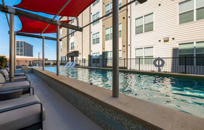 Sparkling Swimming pool and lounge chairs at Mockingbird Flats, Dallas, Texas