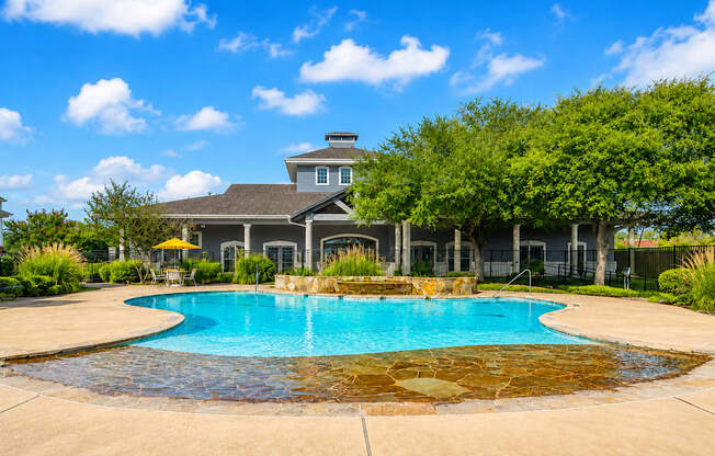 A house with a pool in the backyard.