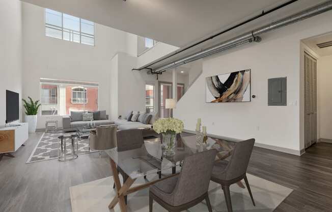 Well Lighted Living room with a glass table at San Pedro Bank Lofts, San Pedro, CA