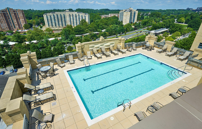 Relax at the rooftop swimming pool with two marked lap lanes and expansive sundeck at Meridian at Grosvenor Station, offering a luxury outdoor oasis with panoramic views of North Bethesda and easy access to the nearby Grosvenor-Strathmore