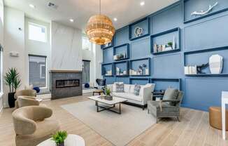 A modern living room with a fireplace and a large chandelier.
