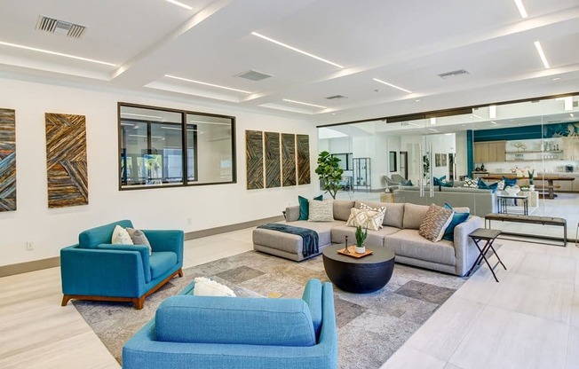 a living room filled with furniture and a large window