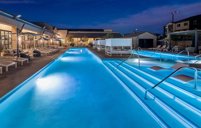 a swimming pool at night at the resort at night