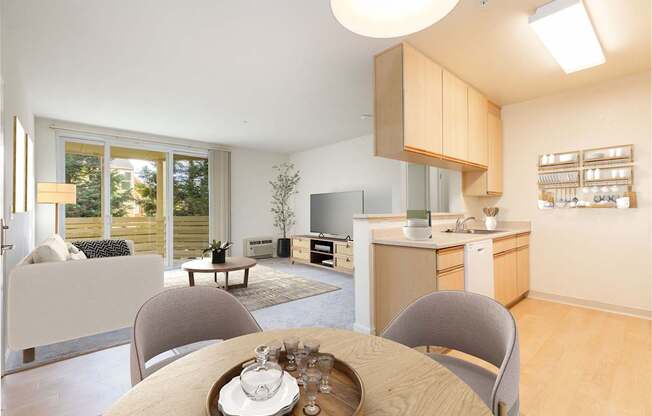 A modern kitchen with a dining table set for two.