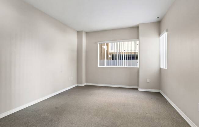 an empty living room with a window