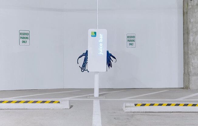 a parking meter in the middle of a parking lot at Aster Apartments, Beachwood, OH 44122