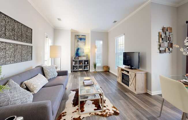 a living room with a couch and a tv