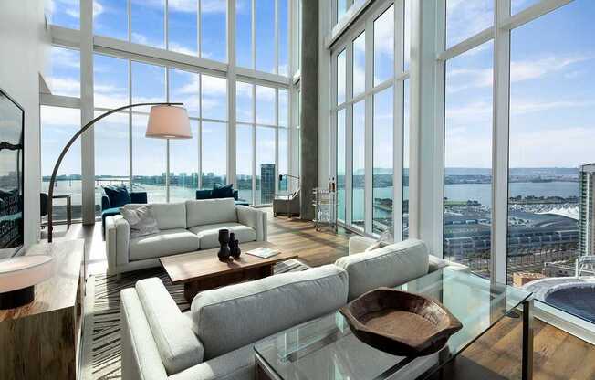 A modern living room with a view of the cityscape.