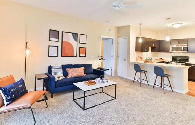 a living room with a blue couch and a coffee table