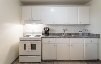 This is a photo of the kitchen of the 1 bedroom, 631 square foot model apartment at Lake of the Woods Apartments in Cincinnati, OH.