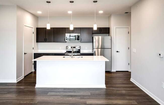 Studio, one two and three bedroom apartments and townhomes featuring open concept floor plans, dens, large windows, stainless steel appliances, quartz countertops, eat-in kitchens, pantries, LVT flooring and much more at The Trails at North Streams in Omaha, NE