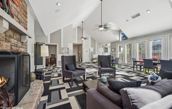 a living room filled with furniture and a fireplace