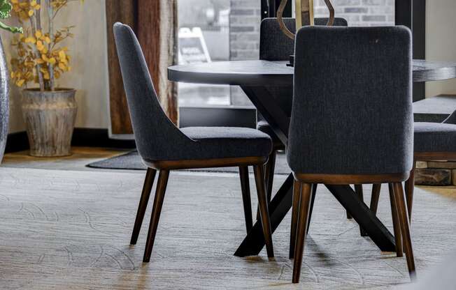 a dining room with a table and chairs