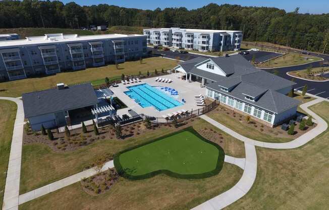 an aerial view of a resort with a swimming pool