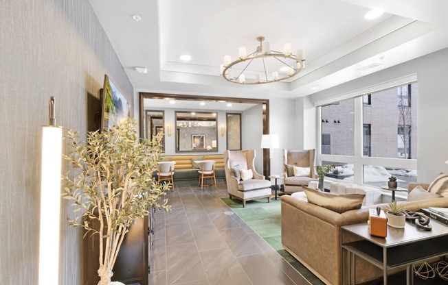 a living room filled with furniture and a large window