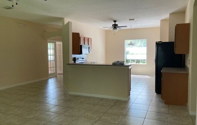 Spacious 4/2/2 Home with Screened-In Porch and Stylish Finishes