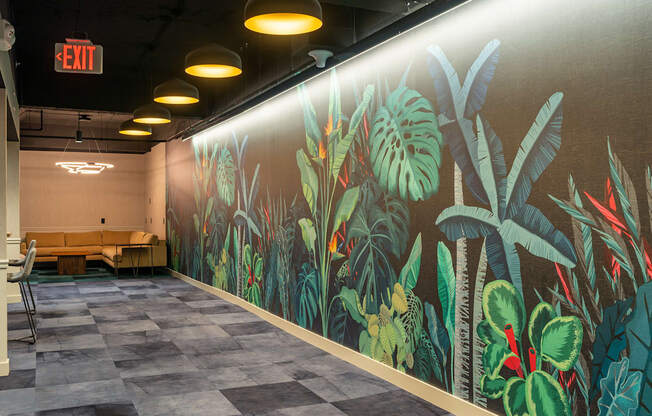 a large mural of plants on the wall of a hall