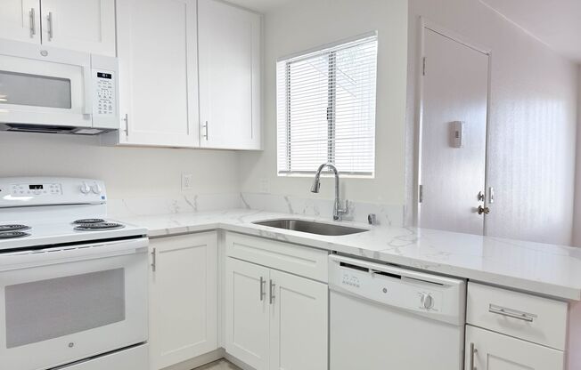 Uptown Villas | Spacious Apartments with parking in Grant Hill!