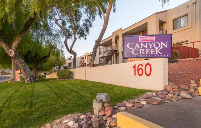 Canyon creek community sign with lush landscape and well kept pathway