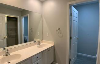 Large bathroom with double vanity and separate shower room