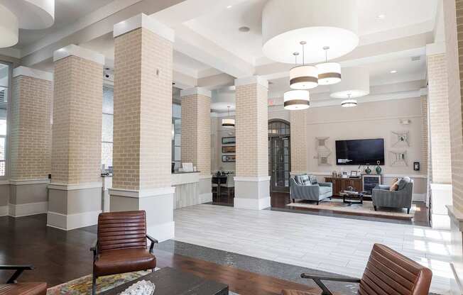 A living room with a brown leather chair and a coffee table.