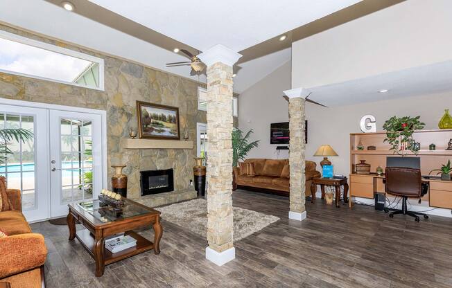 a living room filled with furniture and a fire place